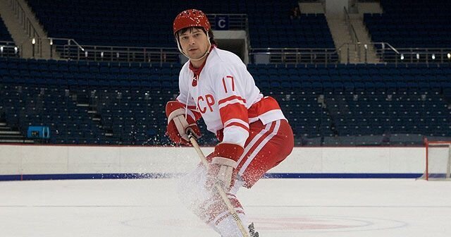 a man in a hockey uniform on ice